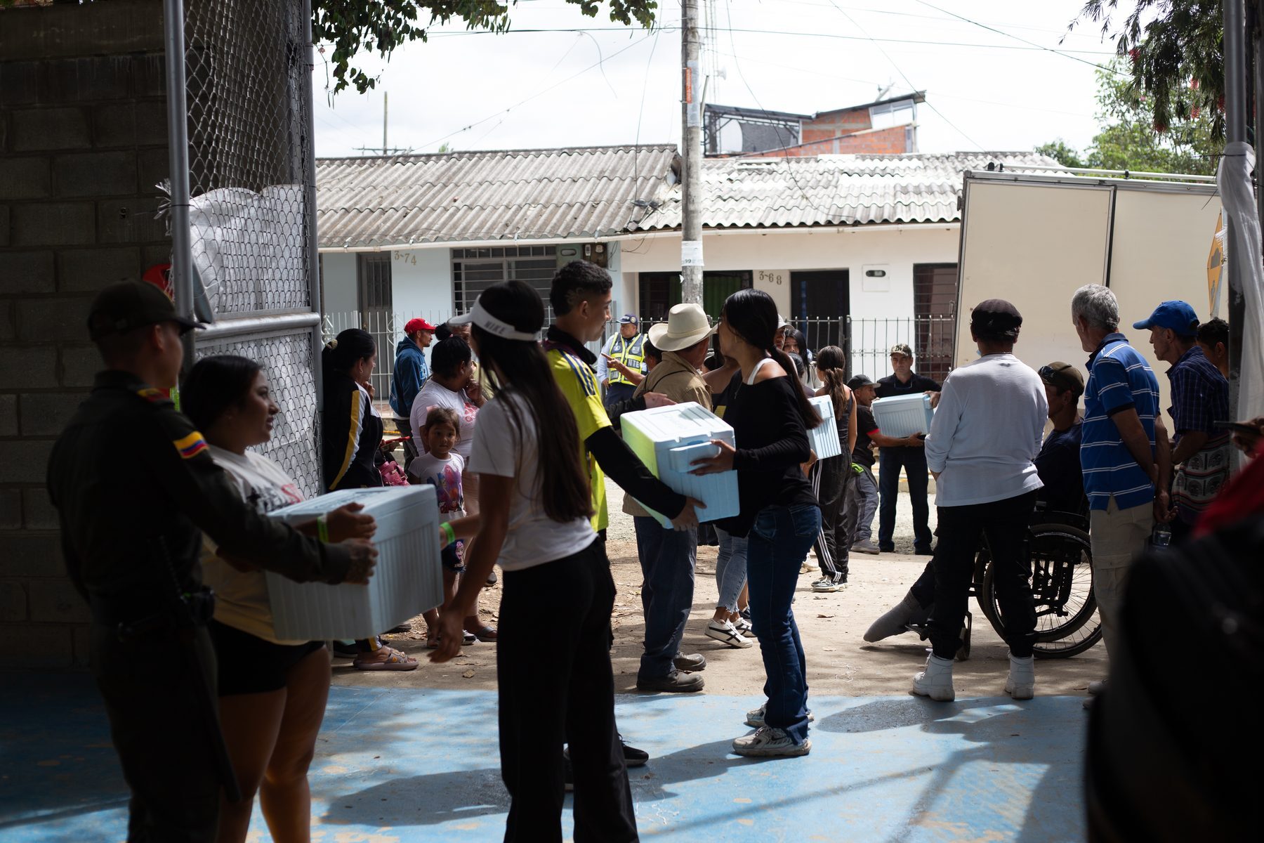 Emergency shelters and aid distribution at a covered sports centre